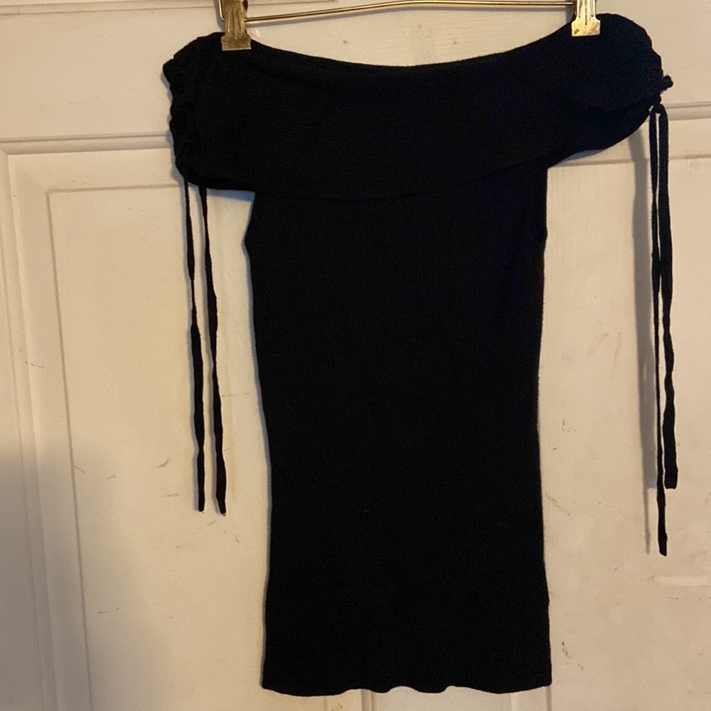 Express off shoulder ribbed black sweater with lace up details on shoulder.